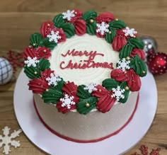 a decorated christmas cake sitting on top of a white plate