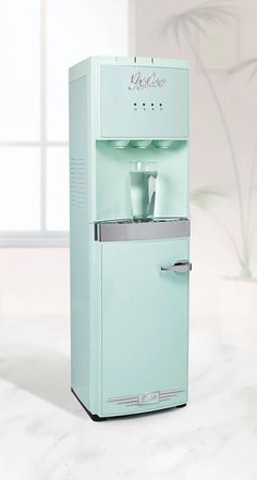 a water dispenser sitting on top of a counter