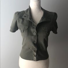 This Snap Front Jacket Is Absolutely Adorable. Perfect For The Fall Over And Tank With Jeans! Fitted Tops With Pockets For Fall, Fitted Utility Jacket, Fitted Collared Utility Jacket With Pockets, Winter Military Collared Tops, Trendy Short Sleeve Outerwear For Work, Fitted Fall Utility Jacket, Fitted Utility Jacket For Fall, Trendy Fitted Cotton Utility Jacket, Utility Tops With Snap Buttons