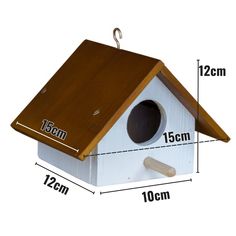 a birdhouse with measurements for the size and height to it's roof, hanging on a hook