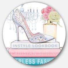 a white high heeled shoe sitting on top of books next to a vase with flowers