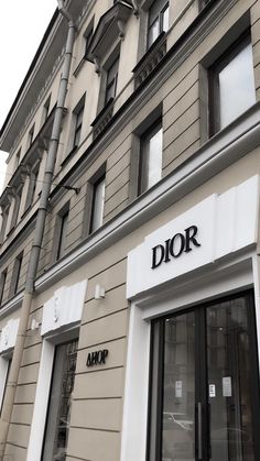 a store front with the word dior written on it's door and windows