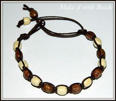 a brown and white beaded bracelet with beads