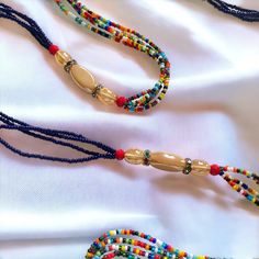 **DRIP FAIRY IS CURRENTLY OPEN FOR PRE-ORDERS ONLY! ALL ORDERS WILL NOT BE SHIPPED OUT UNTIL FEBRUARY 24, 2024. AS A THANK YOU TO THOSE PRE-ORDERING THESE ORDERS WILL ALSO INCLUDE A FREE GIFT! This handmade Ivorian waist bead has an incredibly beautiful four strand design in the colors of purple, gold, and red. Each waist bead is carefully crafted using a combination of strong threads woven together to create a durable and long-lasting piece. The beads themselves are made from glass and each one is carefully chosen to ensure a consistent look and feel to the waist bead. Crafted using high-quality materials, this waist bead is durable and designed to last. The strands provide a comfortable and secure fit, while the adjustable length ensures that it can fit a wide range of waist sizes. The p Waist Beads African, Strong Hand, Waist Beads, Gold And Red, African Jewelry, Ivory Coast, Blue Beads, Unique Charms, Multi Strand