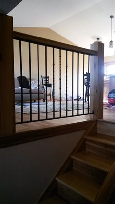 the stairs lead up to an open living room