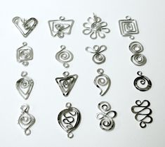 a bunch of different metal items on a white surface with the words chakra links written below them