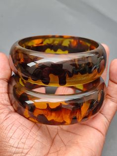 you will receive 1 Piece of Vintage Smooth Honey color Resin Bangle Bracelet Chunky Bangle Statement Purely Handcrafted Bohemian Unique Fashion Jewelry Gift Sale. Inner diameter size - 2.6" approx. Width Size: 23 mm. Thank you very much for visiting! Any questions, please feel free to contact us. Discount for bulk provide. Handmade Brown Round Bangle, Handmade Bohemian Brown Bangle, Handmade Brown Bohemian Bangle, Bohemian Handmade Brown Bangle, Adjustable Resin Bangle, Handmade Multicolor Resin Bracelets, Unique Fashion Jewelry, Color Resin, Earthy Jewelry