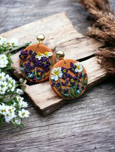 Terracotta-colored polymer clay dangle earrings with wildflowers and greenery. The flower design on these earrings was carefully created using tiny pieces of clay and sculpting tools. The metal is hypoallergenic and nickel-free. Enjoy the beauty of nature in these earrings! Each pair of earrings I create is unique and no two pieces will have the same design. I put a lot of time and effort into creating special jewelry that will bring others happiness. Flower Statement Earrings, Sculpting Tools, Child Free, Polymer Clay Flower Jewelry, Clay Dangle Earrings, Jewelry Flower, Meme Design, Earrings Flower, Polymer Clay Flowers