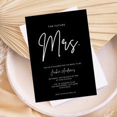 a black and white wedding card with the word mrs on it