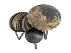 three round metal objects sitting on top of each other