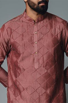 Editor's Note The maroon pintuck kurta and pant set in cotton silk offers a blend of sophistication and comfort. The kurta and pyjama combination is perfect for formal occasions or festive celebrations, exuding an elegant and refined look. Embrace the timeless appeal of this maroon pintuck kurta set for a stylish and graceful appearance. Fabric: Cotton silk Color: Maroon Components: Kurta and pants Occasion: Festive Note: Product colour may slightly vary due to photographic lighting sources Care Festive Cotton Kurta With Pintucks, Eid Straight Kurta With Pintucks, Eid Pintucks Straight Kurta, Cotton Straight Kurta With Pintucks, Traditional Straight Kurta With Pintucks, Traditional Long Sleeve Kurta With Pintucks, Festive Cotton Silk Kurta With Naqshi Detail, Festive Cotton Silk Kurta With Naqshi, Formal Cotton Kurta For Festivals