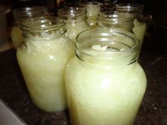 several jars filled with liquid sitting on top of a counter