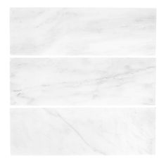 three white marble tiles in different angles