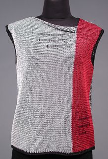 a white and red sweater on a mannequin