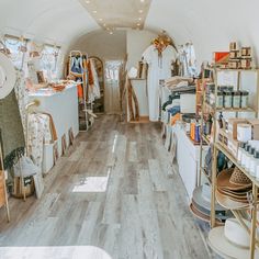 The inside of a airstream store with all the merchandise Mobile Vintage Shop, Airstream Boutique Ideas, Vintage Camper Boutique Mobile Shop, Trailer Store Mobile Boutique, Mobile Retail Trailer, Enclosed Trailer Boutique Ideas, Horse Trailer Boutique, Mobile Boutique Ideas Trailers, Boutique Trailer Mobile Shop