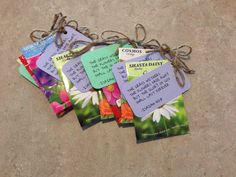 four tags with words and flowers on them