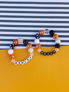 Adorable personalized Halloween 12mm gumball beaded bracelet with the cutest Jack O'Lantern beads and your choice of lettering color.  So cute and sweet and sure to bring a smile to your little one's face!  Perfect for Boo bags, class favors, birthday favors, etc! Please provide the following information in the personalization field: -Name/word you would like -If you'd like any hearts  Recommended Sizes:  3-5 years old- 5-5.5 inches 6-8 years old- 5.5-6 inches 9+ years old: 6-6.5 inches If you n Boo Bags, Keep Bracelet, Boo Boo Bags, Halloween Bracelet, Favors Birthday, Birthday Favors, Jack O Lantern, Fashion Bracelets, Beaded Bracelet