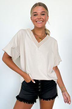 Details: Elevate your everyday look with our Pretty Potential V-Neck Oversized Top. This vintage-inspired tee features a light mineral wash and an oversized fit for a relaxed look. The V-neck front and side slit detail add a touch of style. Made from soft cotton, pair it with shorts or biker shorts for a cool outfit this season. - Short sleeves - V-neck - Relaxed fit - Light Mineral Wash Content: 100% Cotton Size + Fit: Model is 5'8" and 5'4" (Aqua) and wearing a Small - Approximate measurements Cool Outfit, Crop Top Sweater, Oversized Top, Back In Stock, Skirt Leggings, Women Clothing Boutique, Clothing Boutique, Biker Shorts, Comfy Outfits