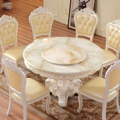 a dining room table with chairs around it