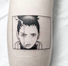 a person with a black and white photo on their leg that has an anime avatar in it