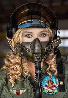 a woman in an air force uniform wearing a gas mask