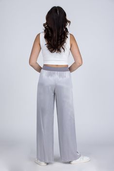 Lounging In Satin Lounge Pants by PJ Harlow will have you feeling elegant day or night! These luxe satin pants feature a wide leg and ribbed waist with adjustable tie. You will feel fancy as you are lounging and sleeping at home! Made in the USA Women owned business Fabric: 75% Rayon 25% Satin Faille Contrast Measurements: Rise (Size M): 31" Inseam (Size M): 12" True To Size S 0-6 M 6-10 L 10-14 XL/1XL 14-18 Satin Wide Leg Pants For Loungewear, Satin Wide Leg Pants With Elastic Waistband, Satin Wide-leg Loungewear Bottoms, Satin Loungewear Pants For Spring, Satin Pants For Spring Loungewear, Casual High Waist Satin Bottoms, Comfortable Satin Lounge Pants, Satin Lounge Pants With Elastic Waistband, Satin Pants With Elastic Waistband For Loungewear