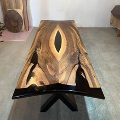 a table made out of wood with an intricate design on it's top and legs