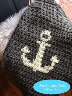 there is a knitted hat with an anchor on it