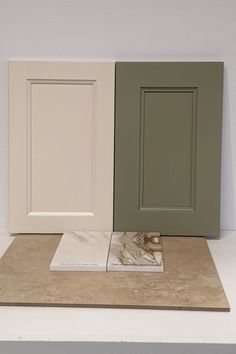 three different colors of cabinet doors sitting on top of a counter next to each other