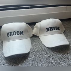 two hats that say groom and bride sitting on the floor in front of a window