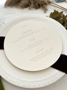 two white plates sitting on top of a table