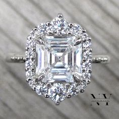 an emerald cut diamond surrounded by diamonds