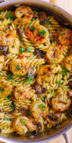 pasta with shrimp and mushrooms in a pan