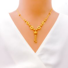 This 22k gold necklace, with a weight of 9.1 grams, showcases a charming cutwork flower design, beautifully rendered in a gleaming yellow gold finish. The necklace spans 17 inches in length, featuring a drop of 1.25 inches, and comes with 1 inch of adjustable links for a tailored fit, secured by an S lock. The intricate cutwork adds a touch of delicacy and elegance, making this piece perfect for those who appreciate the beauty of floral motifs combined with the luxurious appeal of gold. Ideal for adding a sophisticated and feminine touch to any outfit, this necklace is a testament to exquisite craftsmanship and timeless style. PRODUCT DETAILS Gold Purity(karat): 22k Gold Weight(grams): 9.1 Item Finish: Yellow Gold Necklace Length: 17" Drop Length: 1.25" Adjustable Links: 1" Links Lock Styl Yellow Gold-plated Filigree Necklace, 22k Gold Filigree Yellow Necklaces, 22k Gold Flower Pendant Necklace Gift, Traditional Yellow Gold Flower Pendant Necklace, Gold Flower Pendant Necklace In 22k, Gold Necklace With 22k Gold Flower Pendant, 22k Gold Flower Pendant Necklace, 22k Yellow Gold Flower Pendant Necklace, 22k Gold Necklace