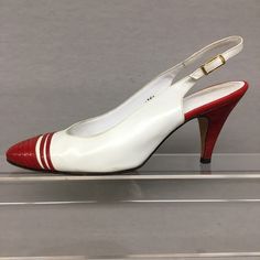 "1980s 8 White Leather Sling back Spectators w Red Lizard embossed accent on Leather Tag/Label: Saks 5th Avenue Size Label: 8 AA Upper Material: Genuine Leather Sole: Genuine Leather - Pointy Toe pumps - gold tone speed buckle ✂------ M E A S U R E M E N T S ------- Best Fit: US 8, EU 38, UK 6 Insole Length: 10\" Ball Width: 3\" Heel Height: 3 1/4\" Please compare these measurements with a pair of your own shoes in a similar style to ensure a proper fit. If you need more information, please ask Luxury Pointed Toe Court Shoes With Red Sole, Luxury White Leather Sole Slingback Pumps, Luxury White Slingback Pumps With Contrasting Heel Counter, Luxury White Slingback Pumps With Round Toe, Luxury White Calf Leather Slingback Pumps, Luxury White Slingback Pumps With Ankle Strap, Luxury White Slingback Pumps With Padded Heel, White Ankle Strap Slingback Pumps, Luxury Modern White Slingback Pumps