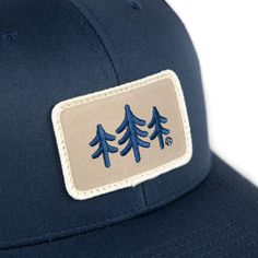 The TriPine Patch Trucker Hat is a stylish and functional addition to your wardrobe. The hat features a mesh back panel for ventilation and a snapback closure for a adjustable, comfortable fit. The front panel is decorated with a cool, embroidered TriPine Patch design. Whether you're hitting the trails or just running errands, this hat is a great way to show your love for the outdoors. Hat Design, Mens Trucker Hat, French Terry Hoodie, White Charcoal, Hat Patches, Fall Accessories, Patch Design, Black Steel, Black Charcoal