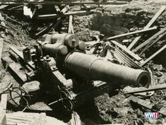 an old black and white photo of a cannon laying on its side in the dirt