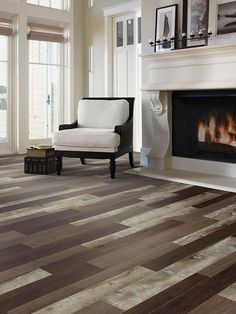 a living room with hardwood floors and a fireplace