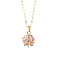 a pink and white necklace with a flower design on the front, hanging from a gold chain