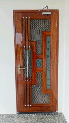 a wooden door with glass inserts on it