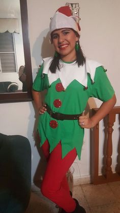 a woman dressed in an elf costume posing for the camera