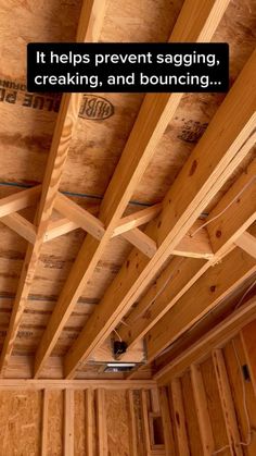 the inside of a house with wood framing and exposed electrical wires on the ceiling is shown