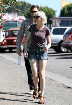 a man and woman walking down the street