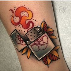 a tattoo with a lighter and roses on it