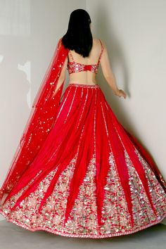 Reddish pink blended tussar lehenga with attached cancan and geometric embroidery in sequins, mirror and applique. Paired with an embroidered padded bustier blouse and an embroidered scalloped dupatta.
Component: 3
Pattern: Embroidery
Type Of Work: Sequins, Mirror and Applique
Neckline: Sweetheart
Sleeve Type: Sleeveless
Fabric: Lehenga and Blouse: Blended Tussar, Dupatta: Net
Color: Red
Other Details: 
Attached Lining
Sequins,mirror and applique work
Occasion: Bride,Wedding - Aza Fashions Chickenkari Lehenga, Party Lengha, Bustier Blouse, Lotus Motifs, Sequins Lehenga, Red Dupatta, Lehenga And Blouse, Lehenga Design, Wedding Lehenga Designs