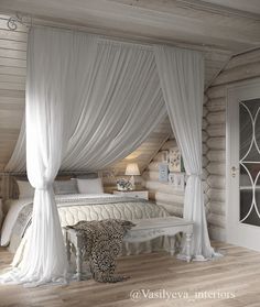 a white bed sitting in a bedroom next to a wooden floor covered in drapes