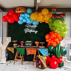 a birthday party with balloons and decorations