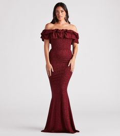 Light up the night in the Halsey glitter formal dress to make your sparkling entrance at galas, black-tie weddings, and banquets. She features an off-the-shoulder neckline with a layered ruffled trim, a figure-flattering mermaid silhouette, and a floor-length hem. The formal dress is composed of a stretchy glitter knit fabric with a bust lining. Complete the look with a clutch and earrings.Fit & FeaturesOff-the-shoulder necklineLayered ruffled trim, bust liningMermaid silhouetteFloor-length Shimmer Evening Dress For Gala During Prom Season, Glamorous Glitter Gown For Night Out, Elegant Ruffled Mermaid Dress For Gala, Glamorous Sparkling Maxi Dress For Formal Events, Glamorous Sparkling Maxi Dress For Formal Occasions, Glamorous Glitter Maxi Dress For Prom Season, Sparkling Fitted Mermaid Dress For Prom, Glamorous Glitter Maxi Dress For Prom, Sparkling Fitted Mermaid Prom Dress