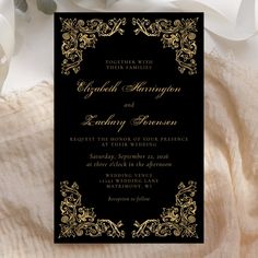 an elegant black and gold wedding card