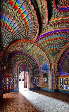 the inside of an ornate building with colorful walls and ceilings